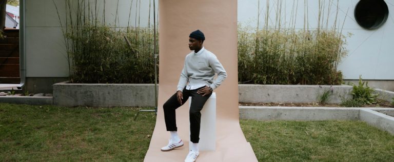 male model wearing grey sweatshirt from the brand Pedro & Tailor