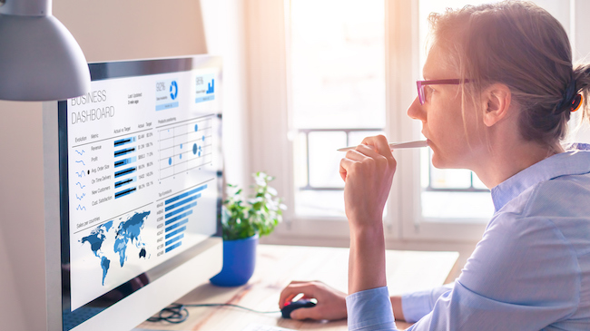 Woman Reviewing Analytics Dashboards